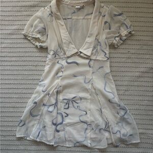 white minidress with purple bows